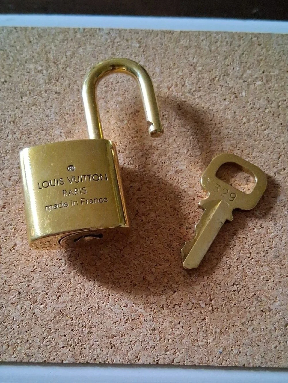 Louis Vuitton Gold Padlock and Key Set Shiny And NEW